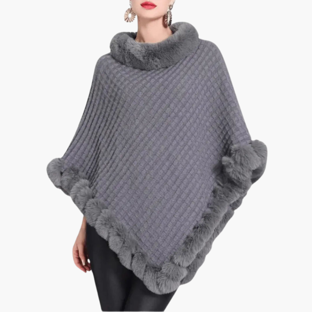 Dames trui poncho met neppels trim