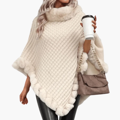 Dames trui poncho met neppels trim
