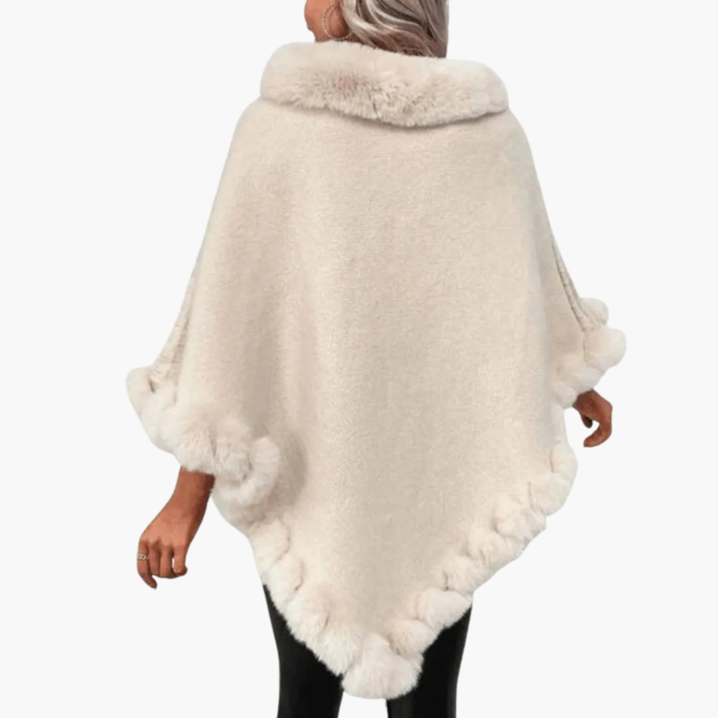 Dames trui poncho met neppels trim