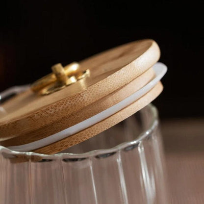 Glazen opbergpot met houten deksel